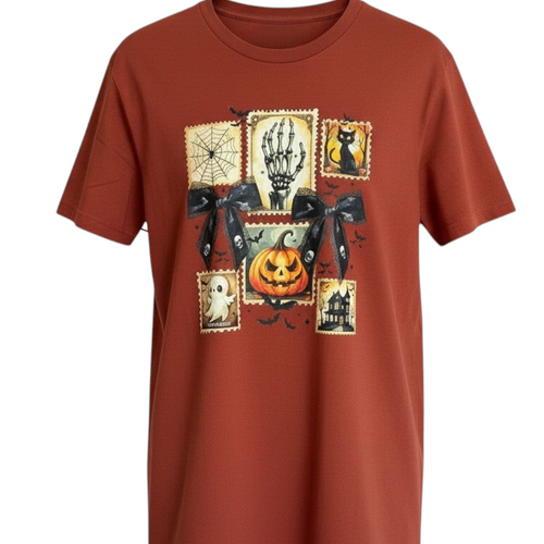 Zia Rose Boutique rust orange cotton t-shirt featuring a graphic print of Halloween stamps and black lace bows.