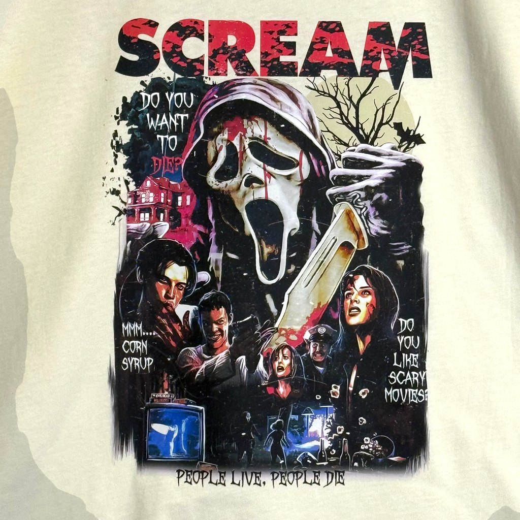 Zia Rose Boutique cream cotton t-shirt featuring a detailed Ghostface Scream movie graphic print with horror motifs.