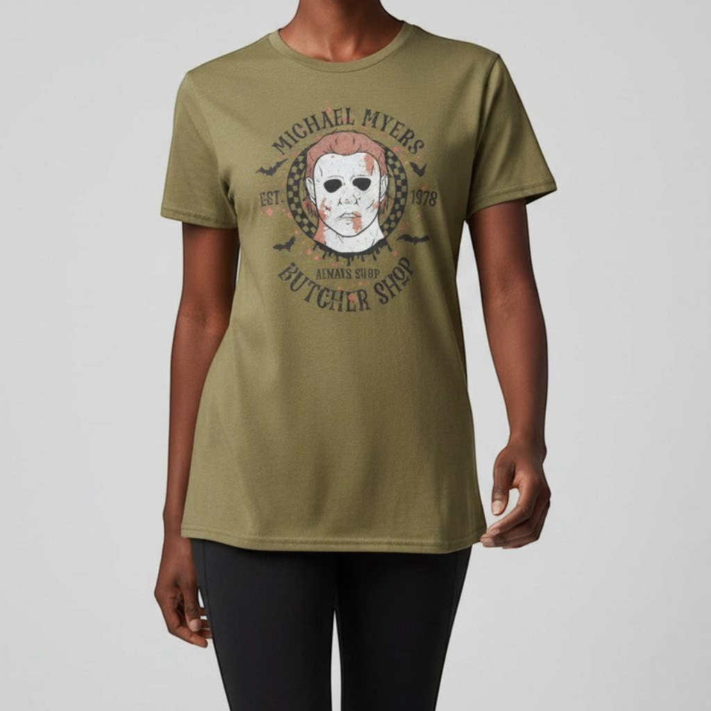 Zia Rose Boutique olive green cotton blend t-shirt featuring a retro Michael Myers horror movie butcher shop graphic