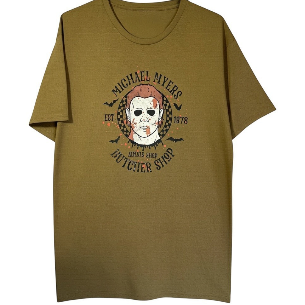 Zia Rose Boutique olive green horror movie graphic t-shirt featuring a Michael Myers butcher shop logo design
